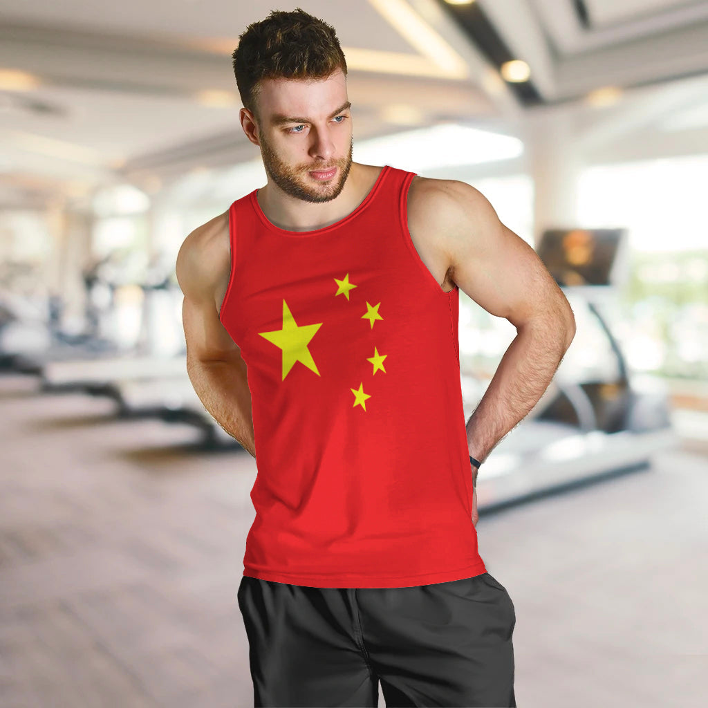 Men's red tank top with yellow star graphic on chest, sleeveless crew neck.