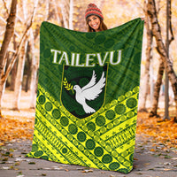 Green and yellow tapa-pattern blanket with white dove 'TAILEVU' logo, large throw size