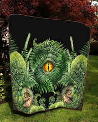 Green dinosaur eye quilt, ferns and seashells pattern on black, rounded edge view