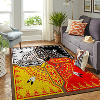 Medicine wheels area rug with red/yellow field and white-black geometric panels