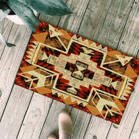Geometric tribal arrow doormat with bold red, black, and gold shapes