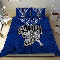 Blue Samoa bedding set on bed with two pillows featuring crest emblems and warrior design