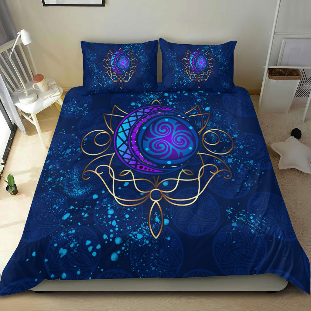 Blue elven bedding set with purple moon circle, gold Celtic bow shapes on duvet front