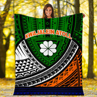 Large tribal blanket with green center medallion, white flower motif, orange accents, and blue trim