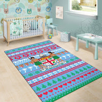 Blue Fiji Christmas area rug in a nursery, showing tiki women, palms, and red-green festive bands.