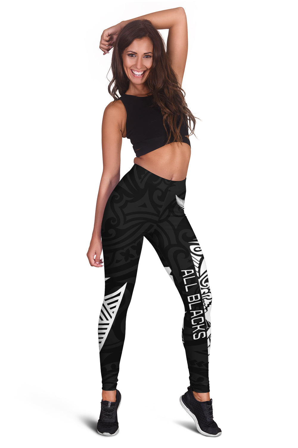 Women's black leggings with tribal-style graphics and haka lettering on legs