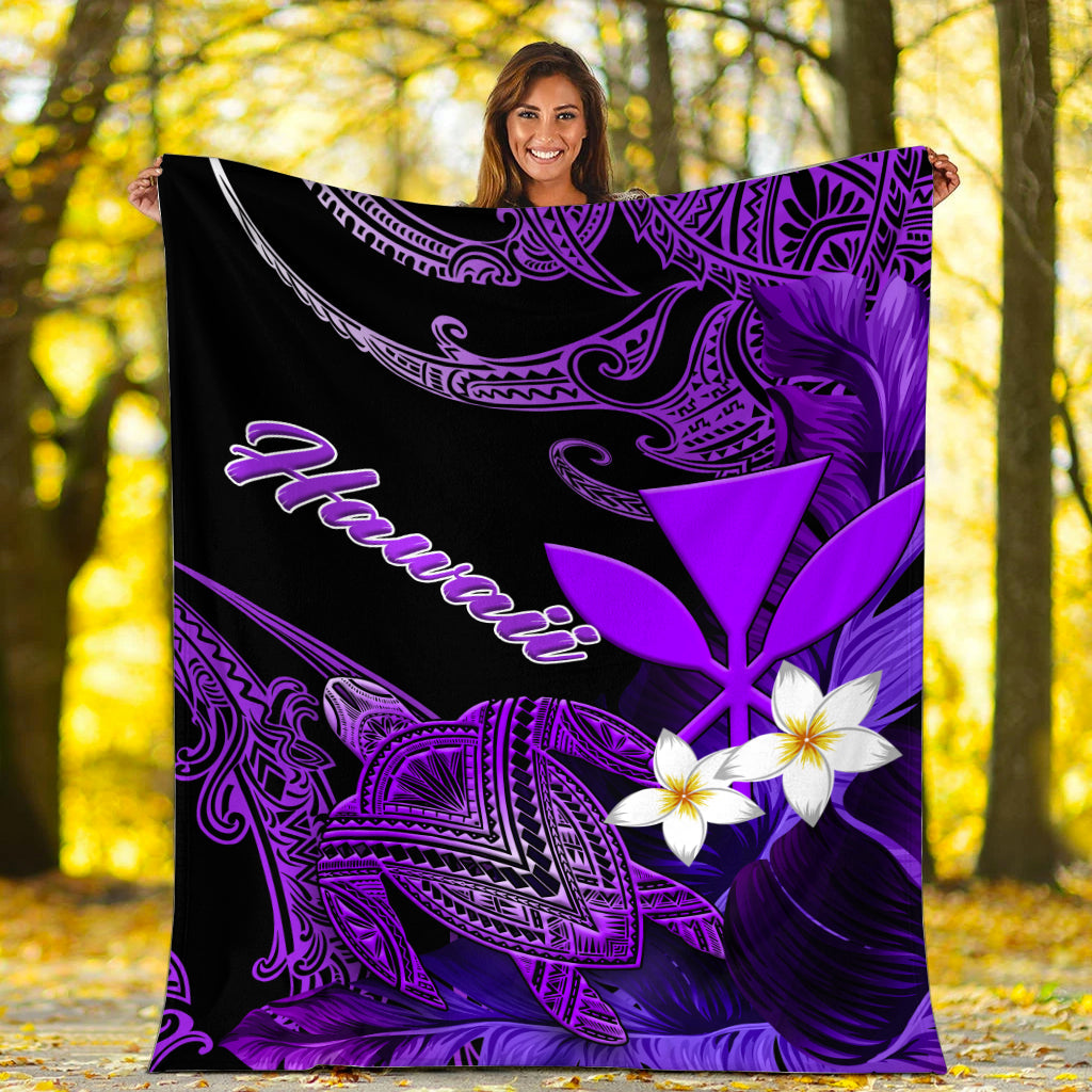 Black blanket with purple leaf and turtle ornament lines, white plumeria blossoms