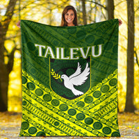 Tailevu rugby blanket flat and centered, green and yellow tapa pattern with white dove logo