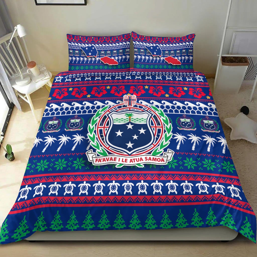 Blue Christmas bedding set on bed: Samoa crest center, red floral stripes, green tree border