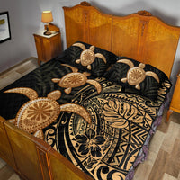 Black quilt bed set with gold turtle motifs and two matching pillows