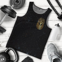 Black sleeveless tank top, gold emblem print, flat lay with accessories