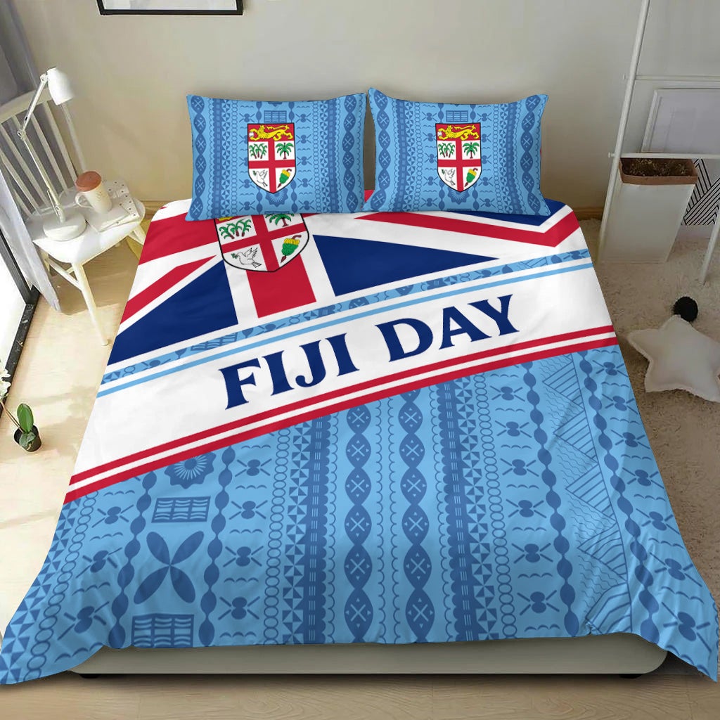 Fiji Day duvet cover with blue tapa pattern, flag-striped band, and crest pillows