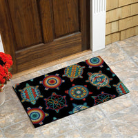 Black turtle-themed doormat with multicolor circular and wheel-like motifs