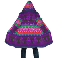 Close-up of hooded purple geometric cloak panel with multicolor stripe patterns