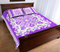 Purple quilt coverlet and matching shams, white floral swirls with diamond trim