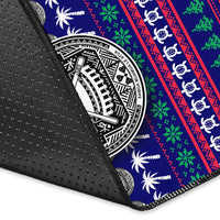 Rug corner close-up showing non-slip black backing with blue festive design