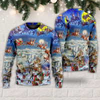 Pair of blue Christmas sweaters with reindeer, Santa sleigh and snowy village print