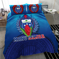 Blue bedding set with crest emblem, laurel leaves, and “MANU SAMOA” across duvet