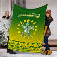 Green and yellow Cook Islands turtle blanket with tribal stripes and gold stars