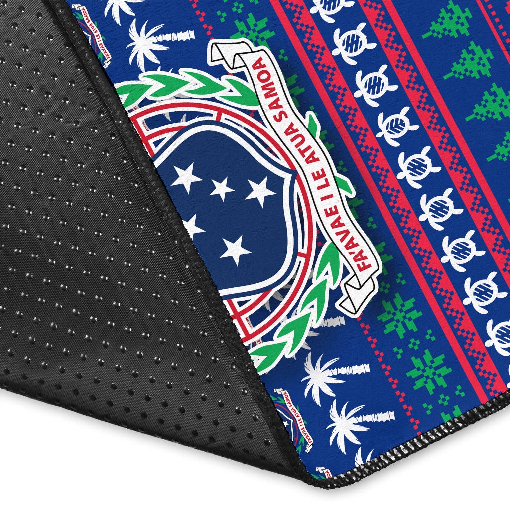 Close-up of blue rug edge with non-slip backing and Samoa crest holiday stripe print