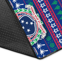 Close-up of blue rug edge with non-slip backing and Samoa crest holiday stripe print