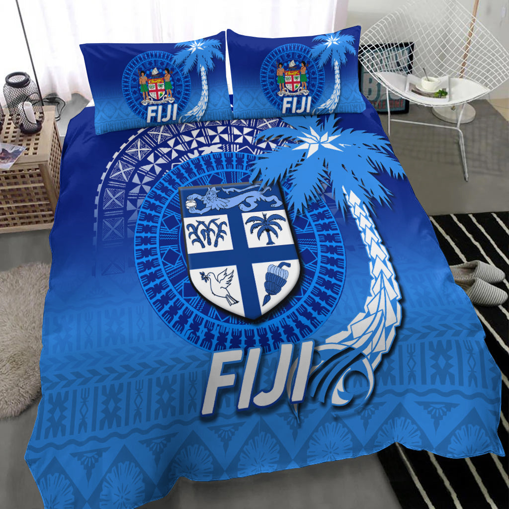 Blue Fiji tapa duvet with shield crest and palm tree graphics, 2 pillows