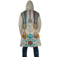 Back of hooded cloak with turquoise and brown beaded panel and central spine design