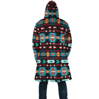 Back view hooded cloak with repeating multicolor geometric stripes and motifs