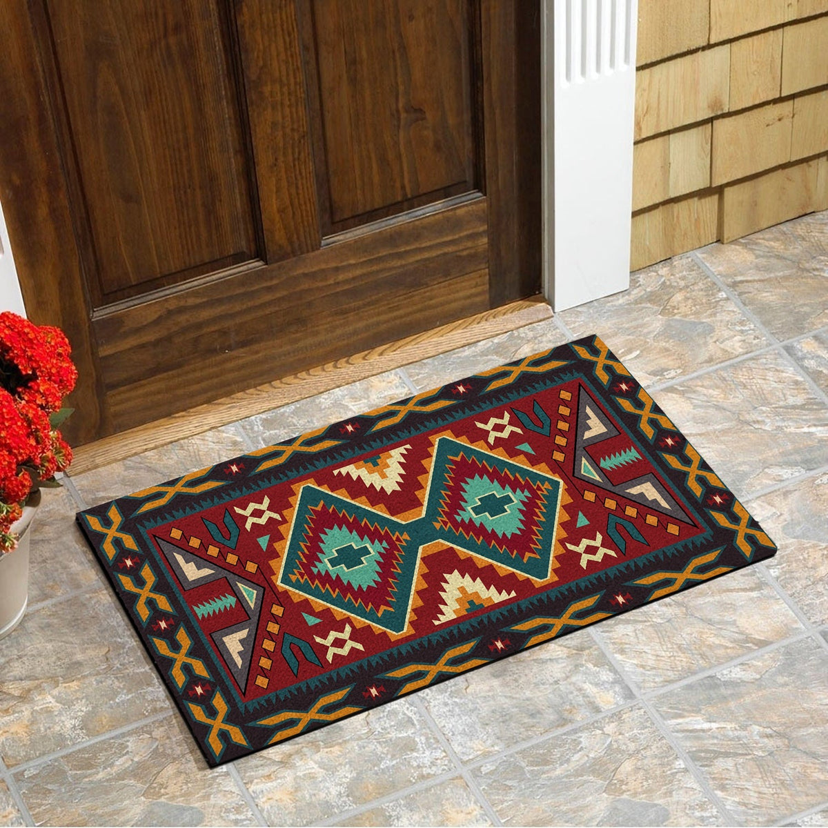 Multicolor geometric doormat on stone floor, teal red yellow diamond and star patterns