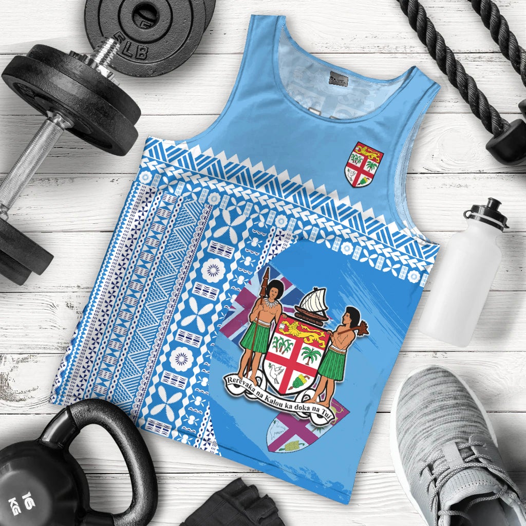 Blue sleeveless tank top with Fiji crest and tapa pattern, laid flat