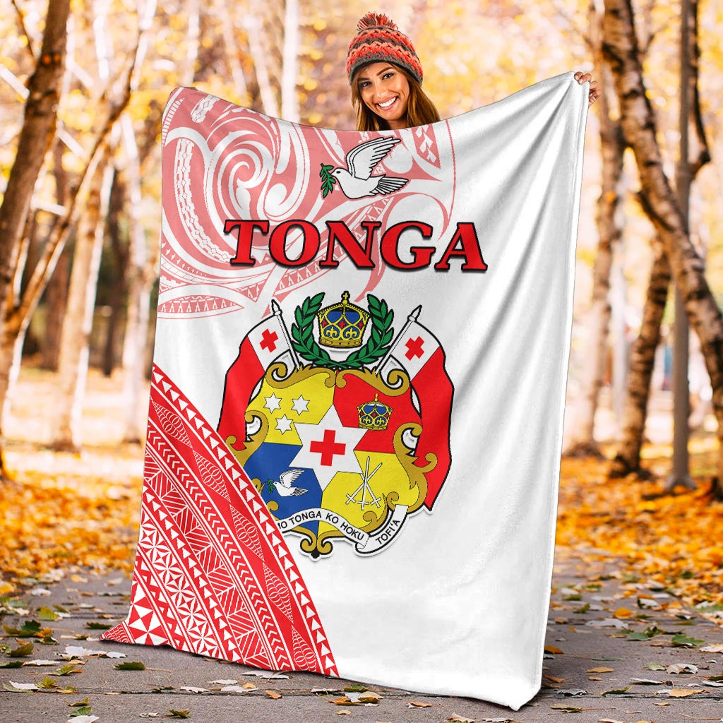 Red and white Tonga crest patterned blanket, triangular border print on white fabric