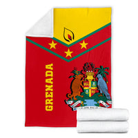 Grenada flag blanket folded with white backing/edge; red with green stripes and crest