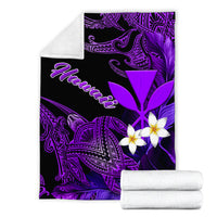 Rolled black-and-purple blanket set with white plumeria flowers and turtle motif