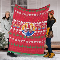 Red Christmas blanket with Tahiti drum design, palm trees, green tree borders, and repeating white script