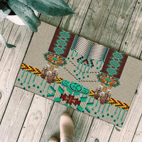 Native-style green doormat with turquoise beadwork motifs and colorful striped border