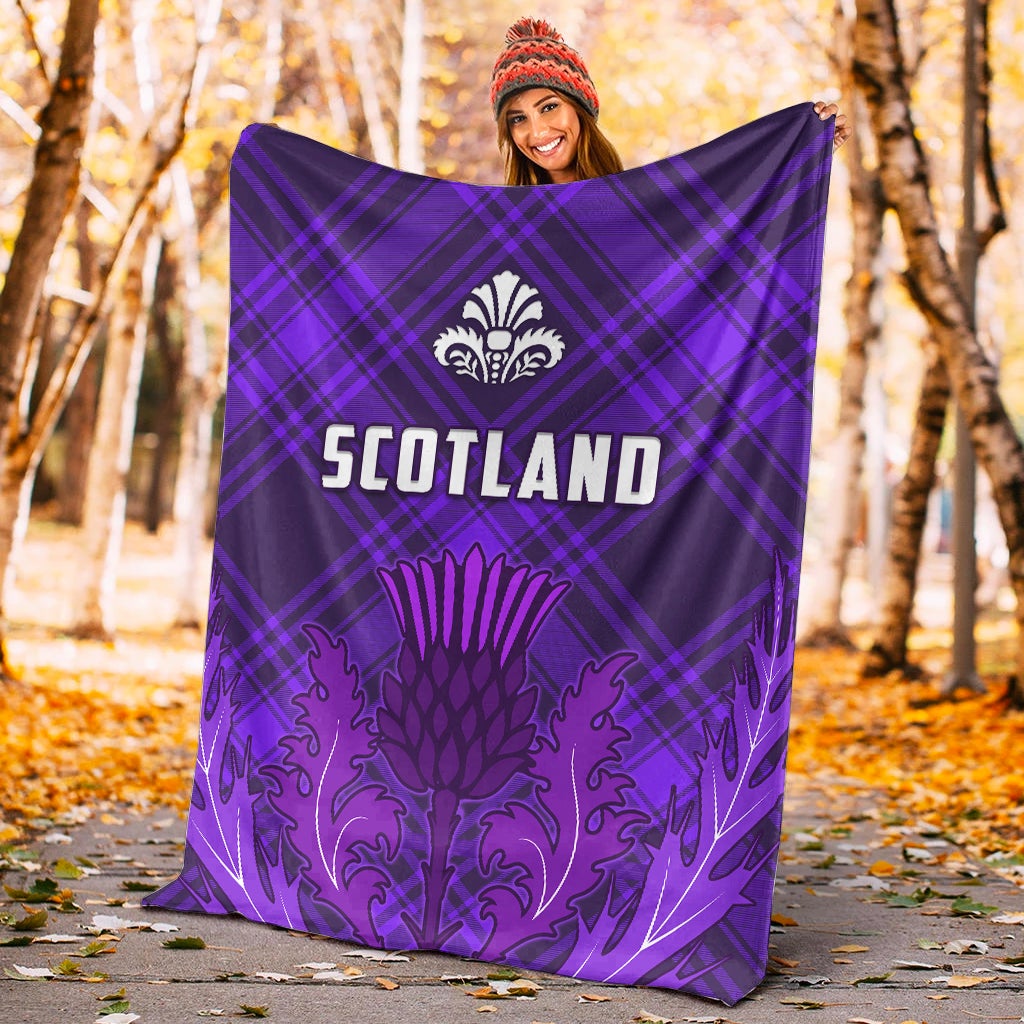 Purple Scotland tartan blanket with thistle crest and “SCOTLAND” lettering