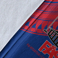 Close-up of blue and red Samoan-pattern blanket fabric with FAST lettering