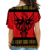 Back of red cross-shoulder shirt, large black phoenix centered with yellow trim bands