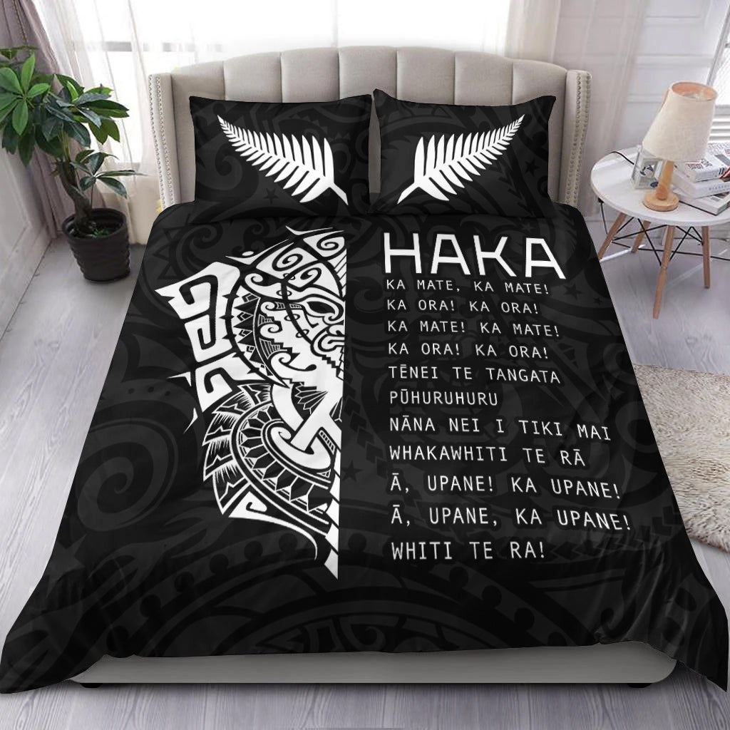 Black bedding set with white HAKA text and fern-like leaf designs, Ta Moko panel