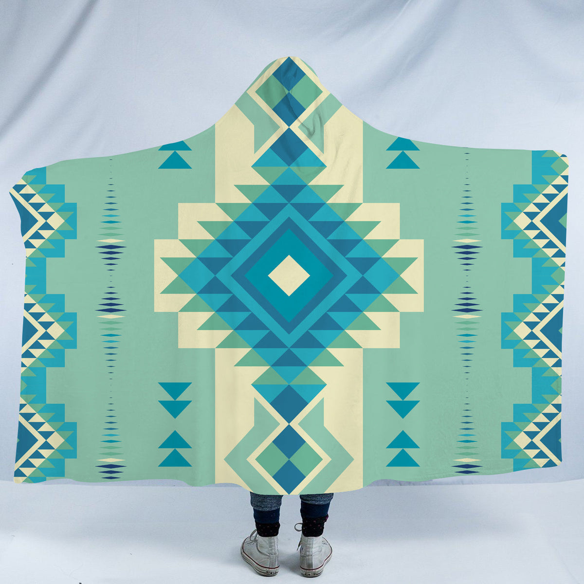 Geometric hooded blanket with turquoise, teal, blue, and cream tribal-style pattern