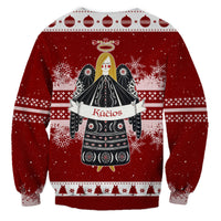 Red unisex Christmas sweatshirt back with angel illustration and 'Kūčios' banner folk print