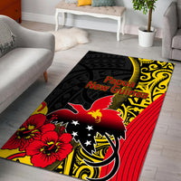 Black area rug with Papua New Guinea graphic, red flowers, yellow patterns, and red stripes