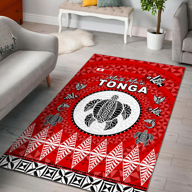 Red Tonga area rug with oval white emblem and black tribal pattern border