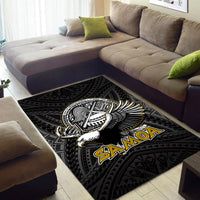 Black rug under sofa with bird crest center and bold 'Samoa' lettering, patterned
