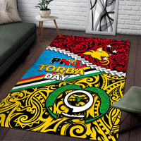 Multicolor PNG Torba Day area rug with red swirl top, blue stripe, yellow scrolls, and emblem.