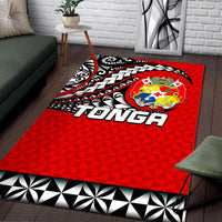 Red Tonga tattoo area rug with black and white tribal curves, crest emblem, and “TONGA” text