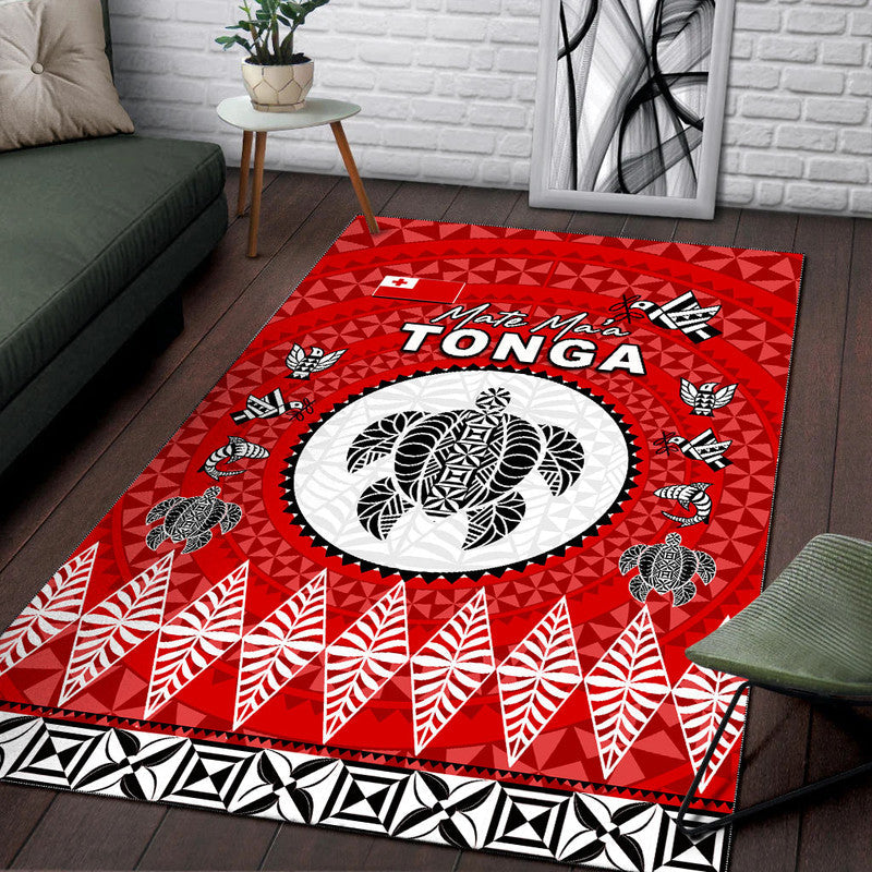 Red Tonga rug with circular white emblem, black accents, and leaf-and-ray border