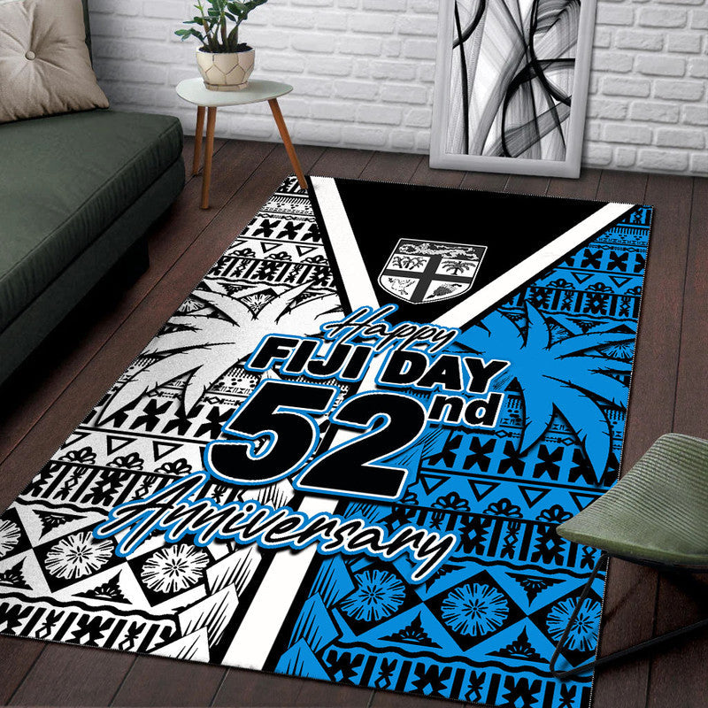 Area rug featuring "Happy Fiji Day 52nd Anniversary" in blue and white with black motifs