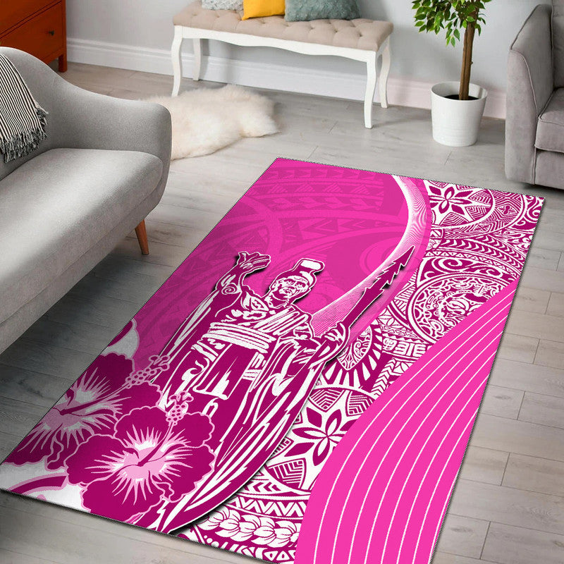 Pink area rug with white Kamehameha warrior and Hawaiian floral scroll pattern.