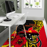 Black area rug featuring Papua New Guinea text, red bird, white stars, and yellow ornament swirls